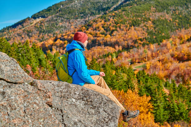 istock Backpacker man at Artist's Bluff in autumn 1156239062