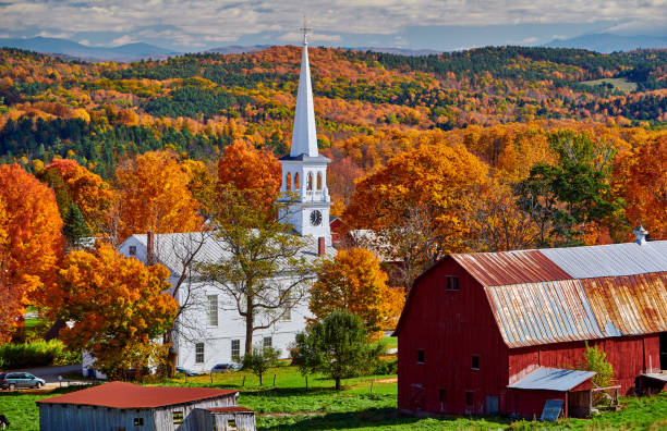 istock Church and farm with red barn at autumn 1156239063