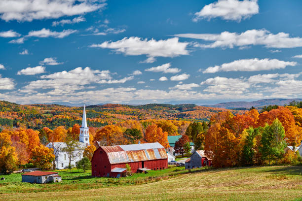 istock Church and farm with red barn at autumn 1156239073