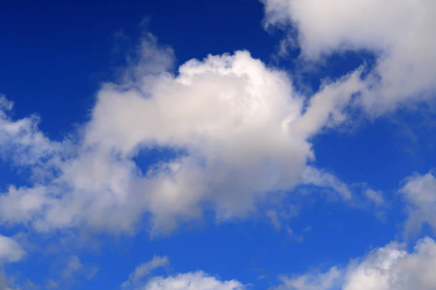 istock hisps of white clouds in a deep blue sky 1156239716