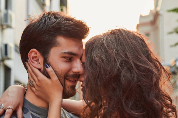 istock Cute young couple outdoors on the street. 1156240834