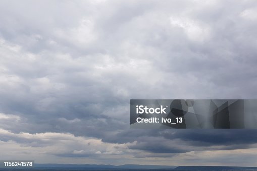 istock Dark sky with storm clouds 1156241578