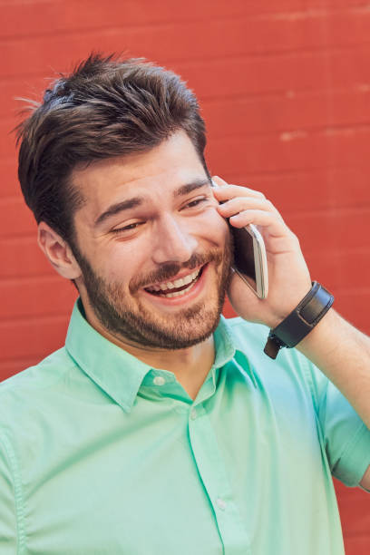 istock Good looking man using smartphone on the street. 1156245096