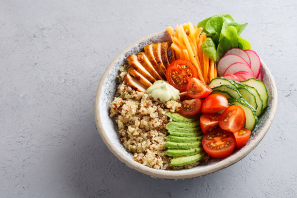 istock Healthy lunch bowl with chicken, avocado and quinoa. 1156245973
