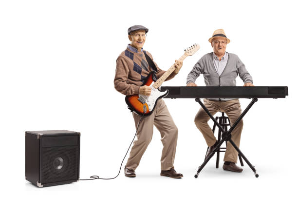 istock Two senior men playing keyboard and an electric guitar 1156246566