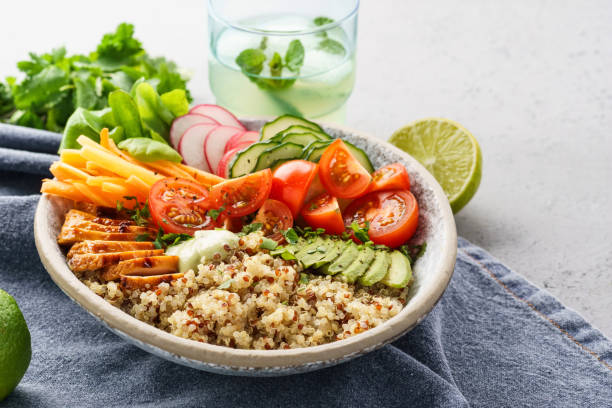 istock Healthy lunch bowl with chicken, fresh vegetables and quinoa. 1156247111