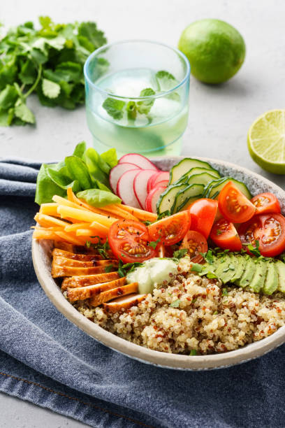 istock Healthy lunch bowl with grilled chicken, vegetables and quinoa. 1156247257