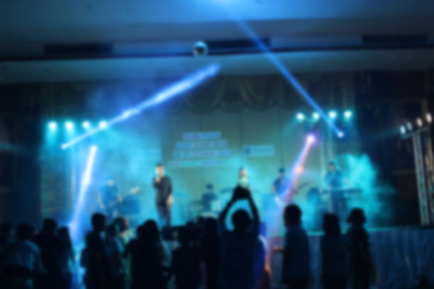 istock People in parties or celebrations blur at night. 1156248717