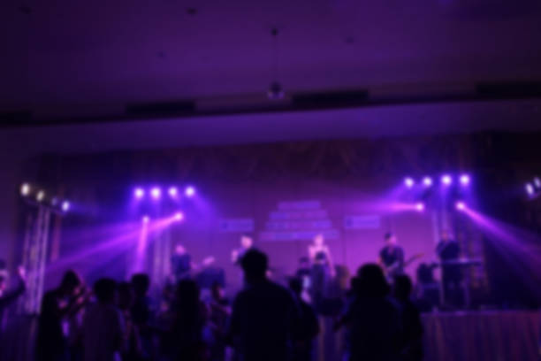 istock People in parties or celebrations blur at night. 1156248779