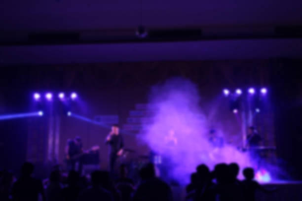 istock People in parties or celebrations blur at night. 1156248852