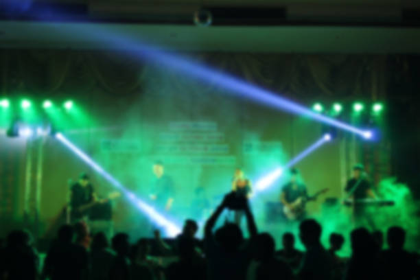 istock People in parties or celebrations blur at night. 1156249469