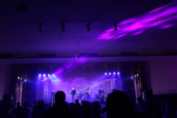 istock People in parties or celebrations blur at night. 1156249597