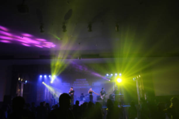 istock People in parties or celebrations blur at night. 1156249676