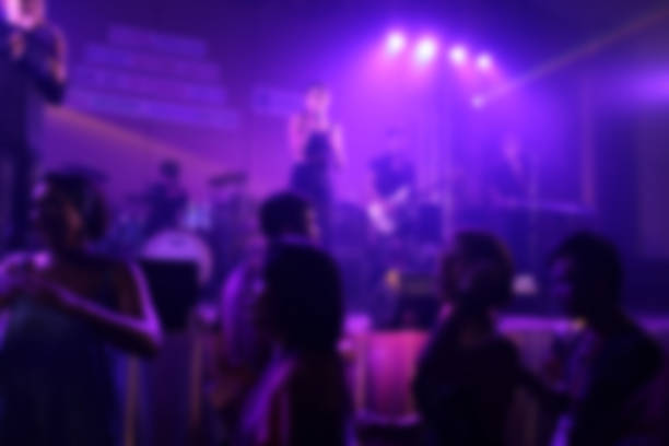 istock People in parties or celebrations blur at night. 1156249888