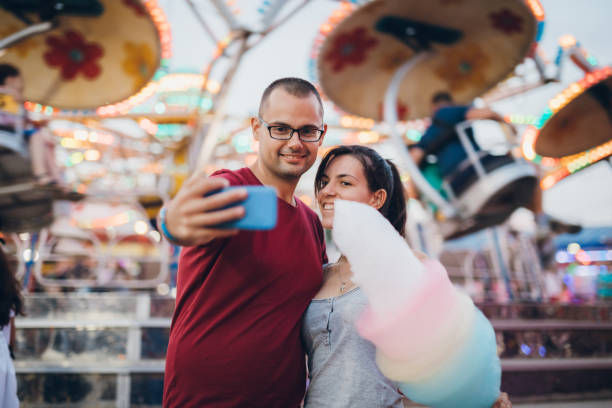 istock Making selfie in amusement park 1156250114