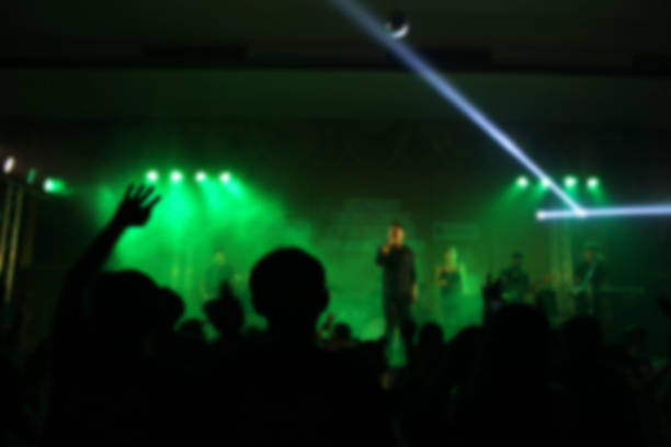 istock People in parties or celebrations blur at night. 1156250851
