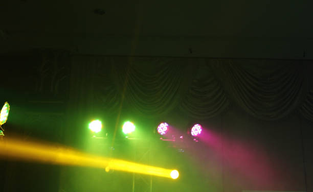 istock People in parties or celebrations blur at night. 1156250871