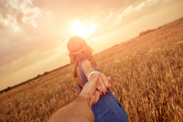 istock Young couple enjoying in a wheat field. 1156250933