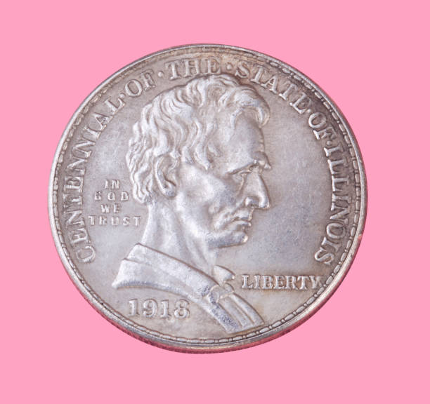 istock half dollar coin isolated on pink background 1156251105