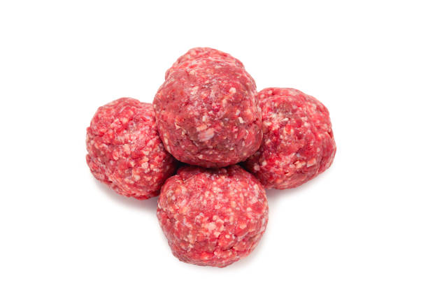 istock Raw meat balls isolated on white background. 1156252907