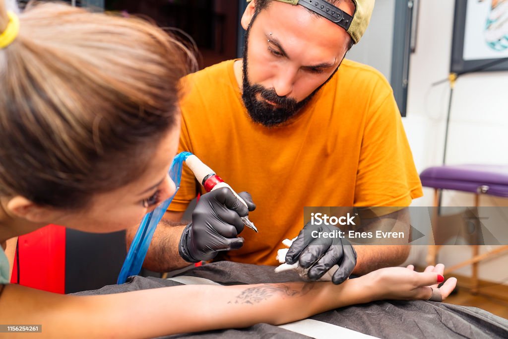Woman Having A Permanent Tattoo In Tattoo Studio Stock Photo - Download Image Now - Adult, Adults Only, Art - iStock Woman Having A Permanent Tattoo In Tattoo Studio Stock Photo - Download Image Now - Adult, Adults Only, Art - iStock