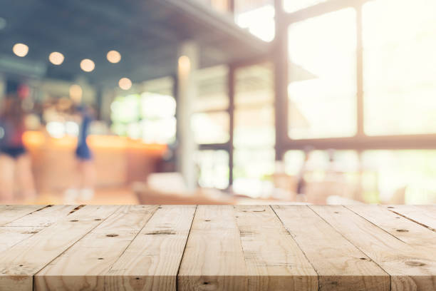 istock Empty wood table and Blurred background : Customer at coffee shop blur background with bokeh, Vintage toned. 1156254490