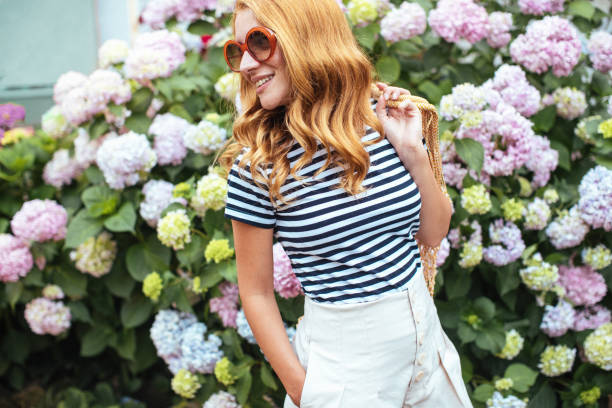 Beautiful girl with Hydrangea flowers stock photo