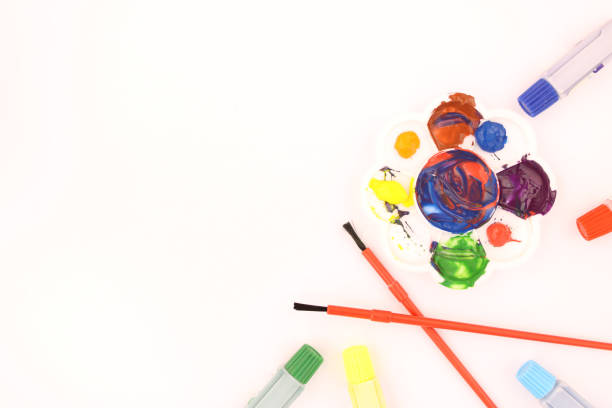 istock Watercolors and brushes and color stains on a white background Lay flat, top view - image 1156257744