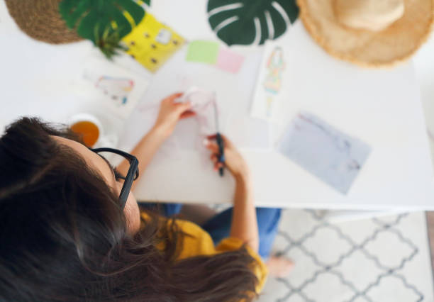 istock Young brunette woman creating her Feng Shui wish map 1156260879