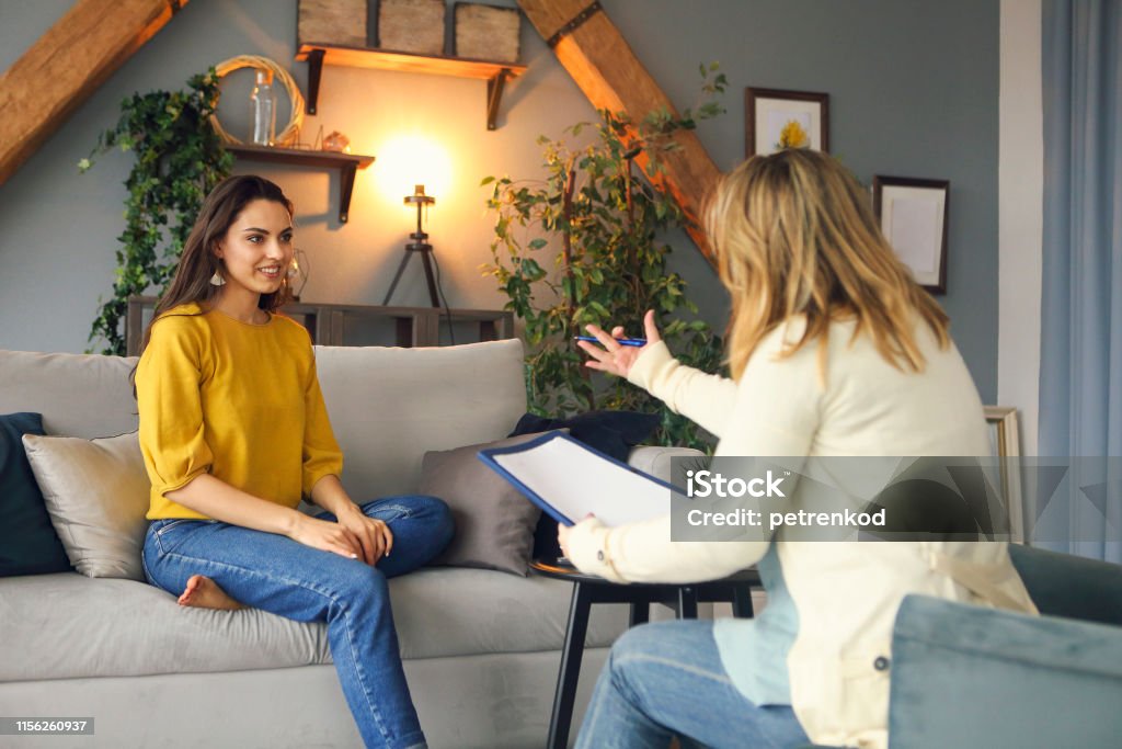 Psychologist having session with her female patient Psychologist having session with her female patient in her private consulting room Psychotherapy Stock Photo