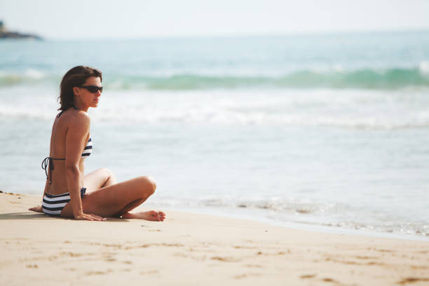 istock Woman at the beach 1156262113