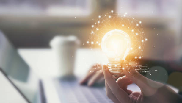 istock Hand holding light bulb with innovative and creativity are keys to success. Concept knowledge leads to ideas and inspiration. 1156263153