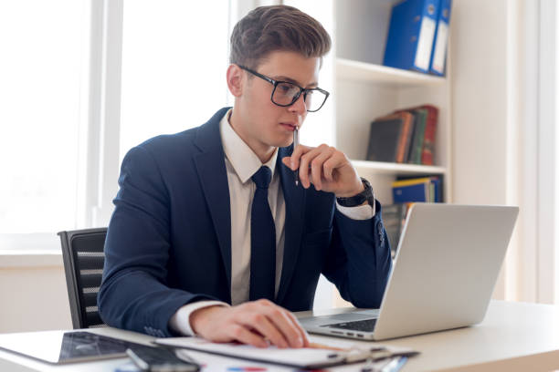 istock Businessman working on laptop computer at office 1156264950