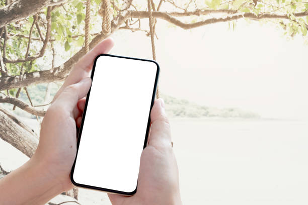 istock Close up Woman hand Using a Smart Phone with blank screen. 1156265034