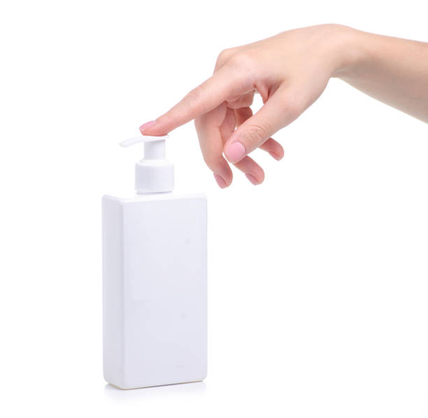 istock White bottle soap with dispenser in hand 1156266853