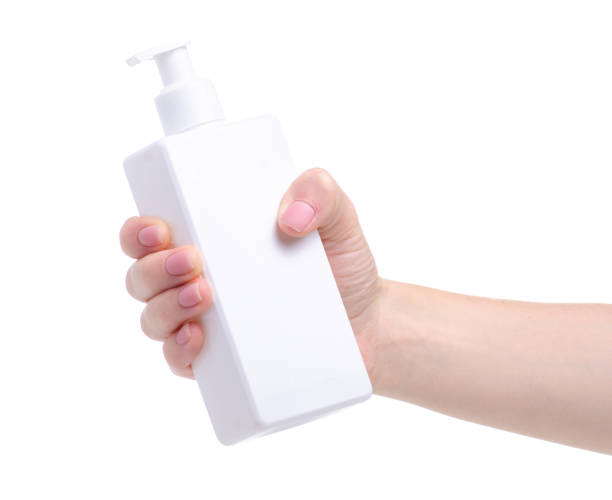 istock White bottle soap with dispenser in hand 1156266881