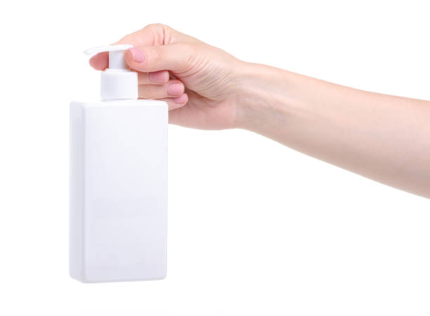 istock White bottle soap with dispenser in hand 1156266895