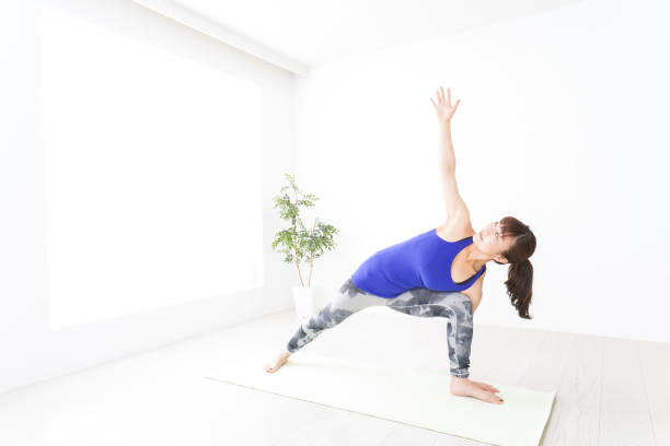 istock Young woman doing a Yoga exercise 1156269659