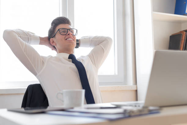 istock Young businessman relaxing at office 1156272068
