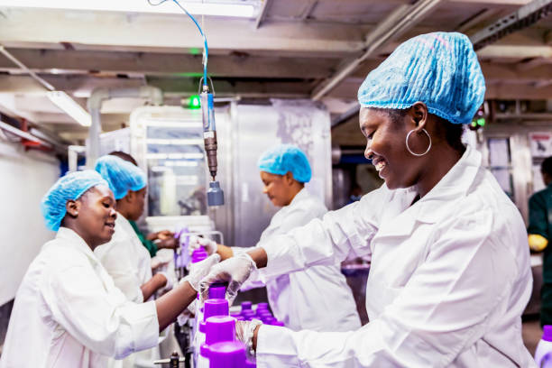Factory, Industry, Business, Employment - African Manual Workers at a Factory