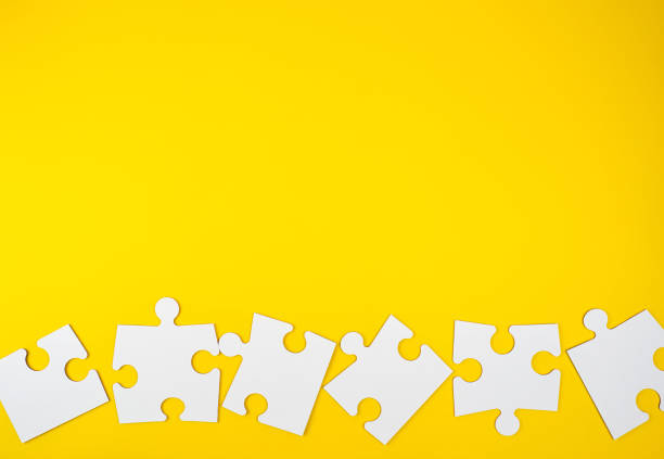 istock blank white big puzzles on yellow background, flat lay 1156276928