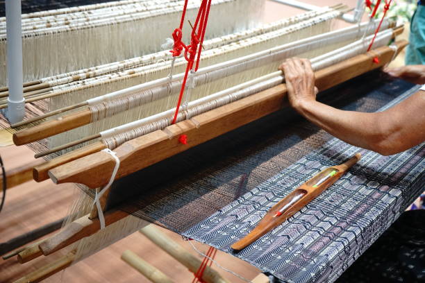istock Close up Weavers are weaving with a loom 1156277101