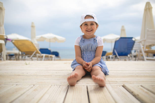 istock Cute little girl smiling while on vacation 1156278054