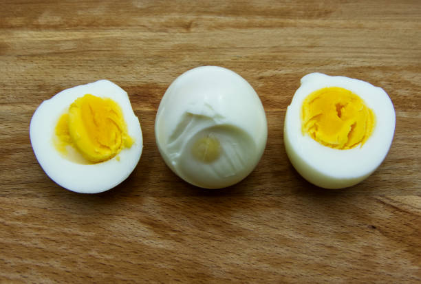istock Boiled egg with a cut boiled egg on wooden table 1156281212