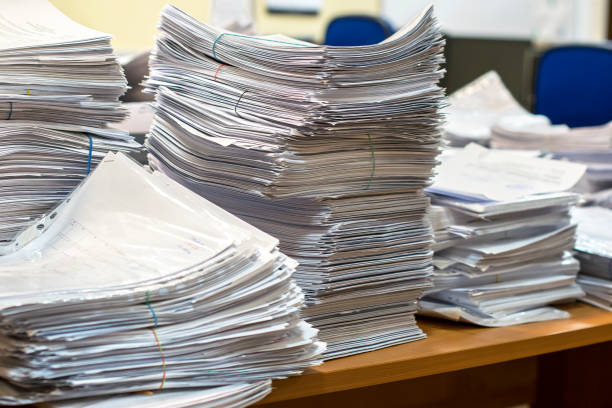 istock pile of paper documents in the office 1156281347