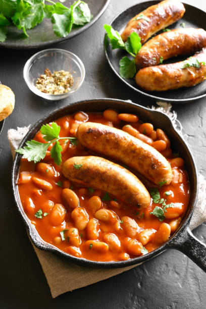 istock Sausages with baked white beans in tomato sauce 1156288601