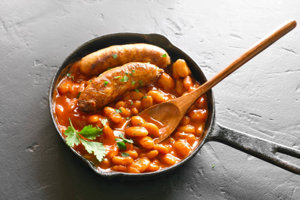 istock Sausages with baked white beans in tomato sauce 1156288629