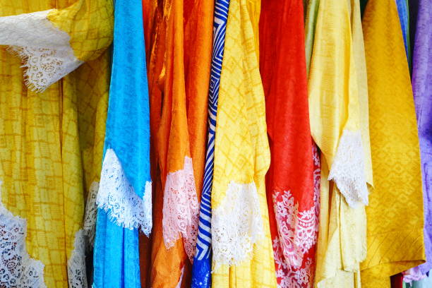 Colorful clothes on sale on asian market Canvas Fabric, Clothing, Cotton, Curtain, Home Decor malaysia batik pattern stock pictures, royalty-free photos & images