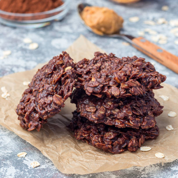 istock Flourless no bake peanut butter and oatmeal chocolate cookies on  parchment, square format 1156289422