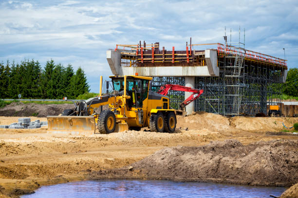 istock Yellow grader in place of future highway 1156291680